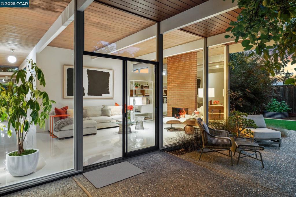 This stunning, light-filled Eichler will “wow” you the moment you walk in, with floor-to-ceiling windows and impressive upgrades throughout. The show stopping kitchen features Bosch appliances, induction range, convection oven, built-in refrigerator and dishwasher, drawer microwave, custom walnut cabinetry, quartz waterfall island, and pull-out pantry. Iconic tongue-and-groove ceilings and globe lighting adorn the kitchen and living room. The primary suite includes custom California Closets with integrated lighting. Beautifully updated baths— the primary with quartz counters and Kohler vanity, the expanded hall bath with custom cabinetry and an enamel tub. Additional house features include solid core doors, Baldwin hardware, resurfaced drywall, and custom walnut hallway cabinets for additional storage. A/C and heat offer year-round comfort, plus an updated electrical panel for modern living, epoxy garage floors, and large-format Porcelanosa tile. The spacious landscaped yard includes smart irrigation, DG paths, artificial turf, an apple, olive, and redwood tree, a tranquil fountain, and veggie beds. A detached office with A/C, keypad entry, and smart lighting provides a perfect flex space. Soak in the hot tub and enjoy the best of California living. This home is a must see!
