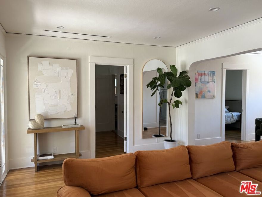 Adorable California Bungalow sanctuary offers the privacy, while being in the middle of it all. Your eyes are immediately drawn to the stunning period windows and the large front door with intricate accent details that set the tone for the rest of the home. Step inside to light and airy living room, where newly refinished hardwood floors shine and a decorative electric fireplace beckons. The bedrooms are connected by Jack and Jill Bathroom. Fully Remodeled for today's comfort and functionality and fully furnished.