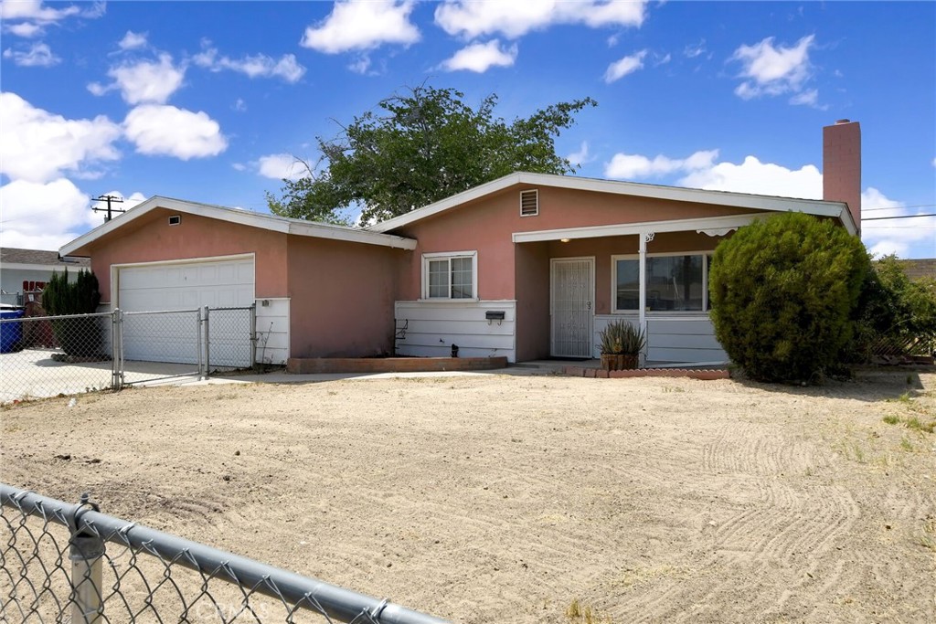 Charming 3-bedroom, 2-bath home in the heart of Victorville – Great Investment Opportunity. This 3-bedroom, 2-bath home is full of potential and perfect for buyers ready to roll up their sleeves and make it their own. Featuring a spacious living room with a cozy fireplace, a dedicated dining area, and a kitchen with ample cabinet space, this home offers a functional layout with great bones. The attached 2-car garage includes washer and dryer hookups for added convenience. Outside, you'll find a fully fenced front and backyard, a large covered patio ideal for relaxing or entertaining, and a newer storage shed for extra space. Located near schools, shopping, and commuter routes, this property presents a great opportunity for first-time buyers, investors, or anyone looking to customize their next home.