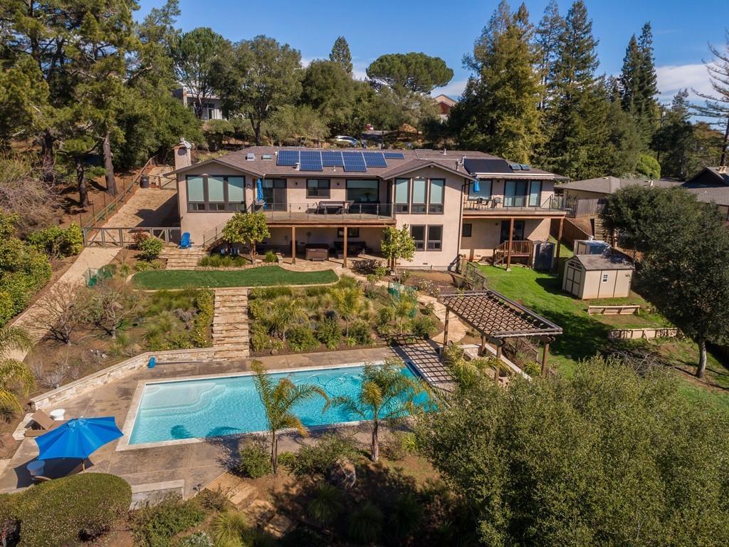 Whole-home, down-to-the-studs transformation plus just-completed 2-bed, 2-bath guest house with living room and full kitchen. Central Portola Valley location with amazing Windy Hill views from almost every room in the 5-bed main home and guest house. Chic luxury all around with skylights, open design, Calacatta marble, ash hardwood floors, and custom-made cabinetry. Motorized window coverings and outdoor awnings, clear-glass railings on decks, new landscaping and renovated pool area, free-standing spa, and outside bath with curbless shower. Stunning kitchen, family room, dedicated office, several built-in desk centers, recreation room, and fitness center everything needed for today. 2-story floor plan offers wonderful separate quarters on lower level if needed. Excellent storage throughout plus 2-car attached garage with dog-washing station. Fruit trees, plenty of gardening potential, and space for horses.
