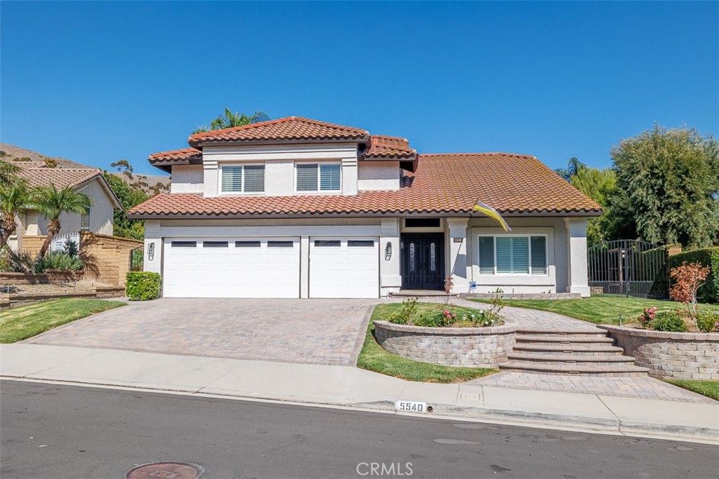 This is the one you've been waiting for! Welcome to 5540 Green Hollow Lane in the Brighton Meadows tract of Bryant Ranch, Yorba Linda. Boasting approximately 2764 square feet of living space, this home offers four nicely-sized bedrooms and three full bathrooms, with one bedroom located on the main floor with an adjoining, fully-remodeled bath. Step through the double doors at the top of the stairs and enter the primary bedroom suite, complete with a spacious retreat with fireplace, remodeled, en suite bath with double-vanity, huge walk-in closet, deep soaking tub, and separate stall shower, all under volume ceilings. There are two secondary bedrooms upstairs and a second, completely remodeled full bath. The first level features a formal, double-door entry, with living room and formal dining area with cathedral ceilings immediately to the right. The remodeled kitchen with breakfast bar is fully open to the family room with fireplace and custom shelving. A separate laundry room is just off the family room hallway. Stepping into the huge backyard with large covered gazebo, you'll find the custom-built fifth bedroom/office/she-shed/man-cave complete with electrical service, full insulation, and dual-paned windows. Back inside the home, there are just too many upgrades to mention here, but some include: plantation shutters throughout, vinyl dual-pane windows and sliders throughout, newer laminate flooring on the second level, newer paint inside and out, added recessed lighting throughout. Great Yorba Linda schools: Bryant Ranch Elementary is 5 minutes away, Travis Ranch Middle School, and Yorba Linda High School. Brush Canyon Park is just across the street with tennis, basketball, and pickleball courts, baseball and soccer fields. Santa Ana River trail offers jogging and cycling. Close to dining, shopping, entertainment, 91 freeway and the 241 tollroad.