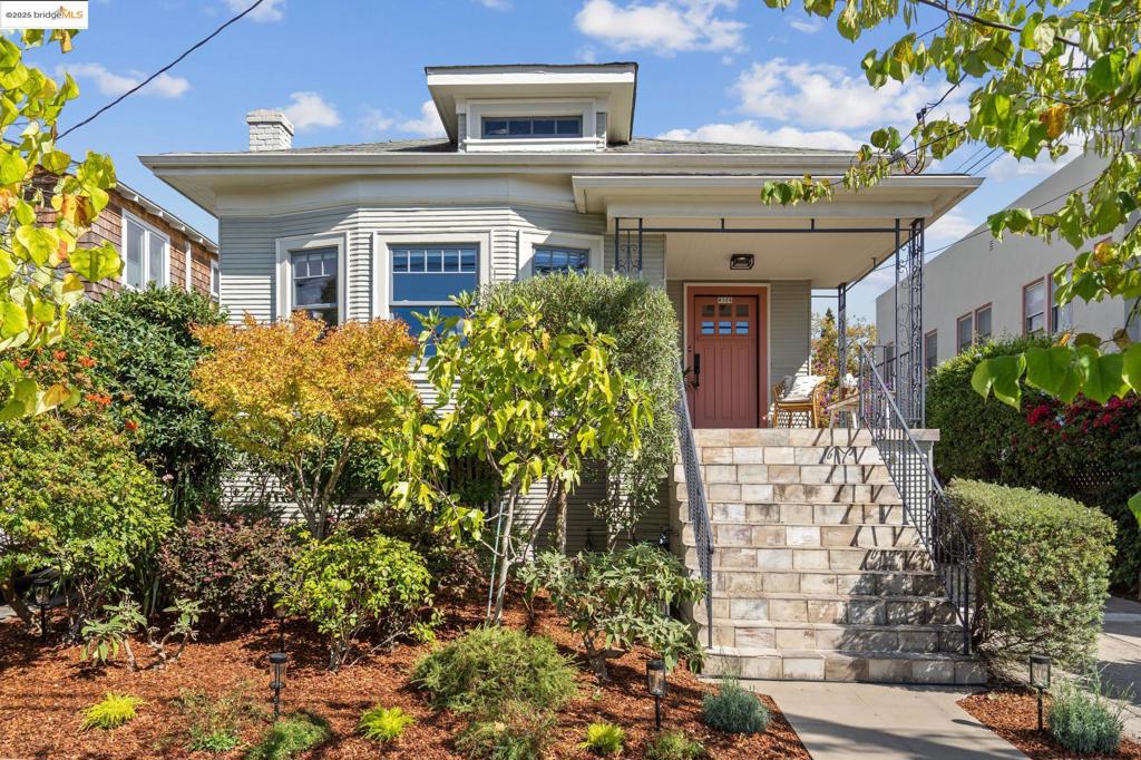 Lovely Temescal Bungalow with Stylish Garden Cottage ADU. This gorgeous bungalow dazzles with historic charm and modern updates. Enter into a spacious living room flooded with natural light, original hardwood floors, and a lovely stone fireplace. A formal dining room with a delightful box beam ceiling sets the stage for dinner parties. Beyond the dining room, a fully updated kitchen awaits, loaded with counter space and cabinets, as well as a Bosch induction cooktop and built-in Kitchen Aid refrigerator. The spacious kitchen leads to a lovely sunroom, perfect for enjoying morning coffee while gazing at backyard flowers. The main house has 3 bedrooms as well as 2 bathrooms featuring luxury updates such as marble tile and towel warmers. Mature landscaping graces the garden oasis with bougainvillea, roses, trumpet vine, and more. Nestled in the yard, a modern, stylish ADU with a kitchen and private bathroom offers the perfect retreat for guests or office. A large basement awaits your dreams – Workshop? Art Studio? Gated off-street parking, dual-pane windows, gigabit ethernet, upgraded electrical panels, separate electrical meter for ADU. Fabulous location! Close to the popular Temescal, Piedmont Ave, and Rockridge neighborhoods. BART & Freeways. Just one block to great coffee!
