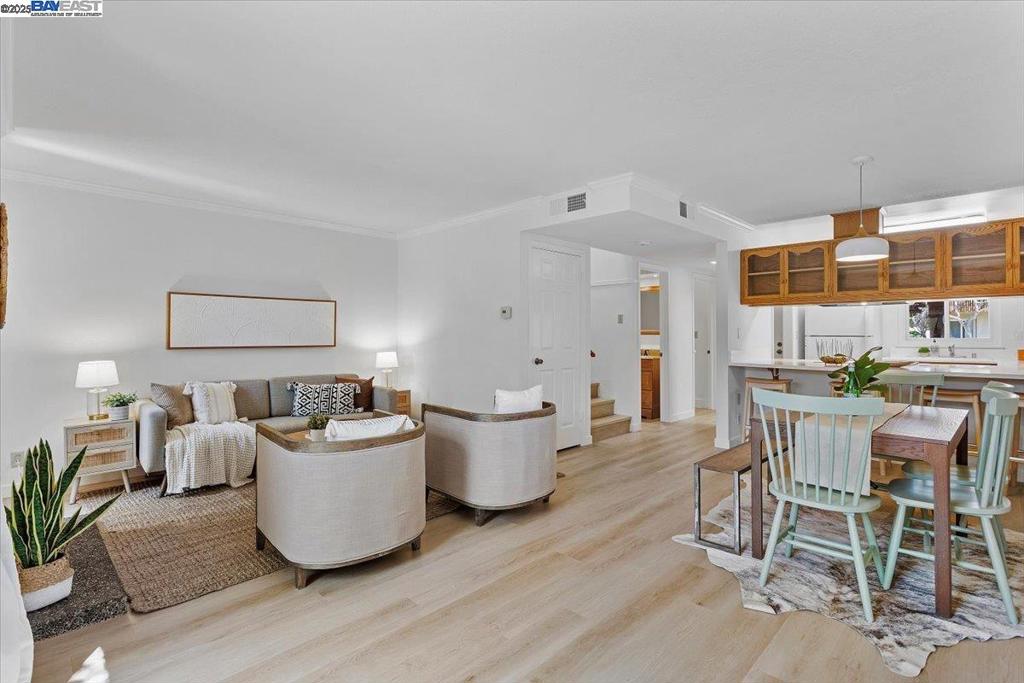 Casitas Classic. Fresh, Bright & Effortlessly Livable. Welcome to 1105 Fontana Drive, a crisp and stylish 2-bed, 1.5-bath townhome in Alameda’s ever-popular Casitas community. With fresh white walls, new flooring throughout, and a layout designed for easy living, this home is equal parts charm and function. Downstairs, the open-concept living and dining space flows to a private patio, your personal outdoor escape, perfect for a quiet morning coffee, weekend BBQs, or hanging out with friends. Upstairs, two sunlit bedrooms offer generous closets and a calming vibe, ideal for recharging or working from home. Enjoy the convenience of a detached two-car garage, in-unit laundry, a half bath downstairs. The Casitas community brings resort-style perks including a sparkling pool, a sprawling clubhouse, and lush greenbelts. Located near the Bay Trail, top-rated schools, local shops and eateries, and major commute routes including the SF Ferry, Transbay bus, and BART, this is your chance to plant roots in one of Alameda’s most loved neighborhoods. Stylish, simple, and set up for your next chapter, Fontana Drive delivers