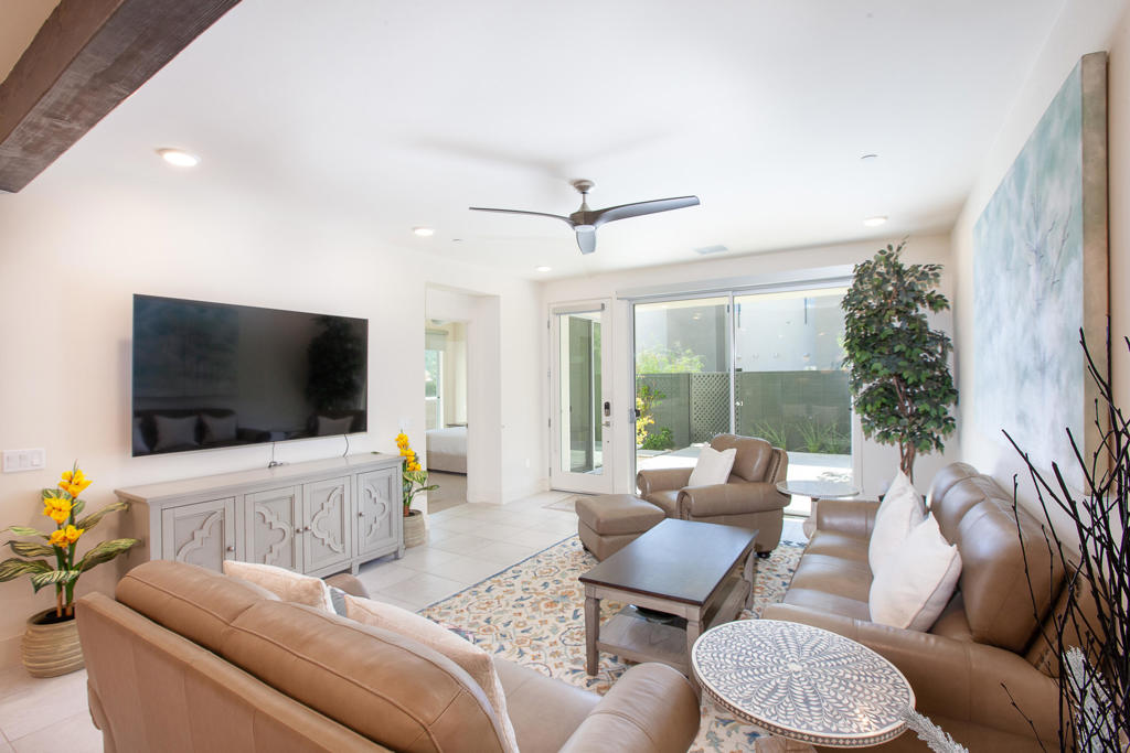 This 2 bedroom 2.5 bath condo with a nice wrap around fully landscaped private patio is in the 64@Riv community. It is an open living area with a Great Room, Living Room, Kitchen, and Dining area. It has sliders that open onto the 2 separate patios. Including low-e glass lighting and tankless water-heater. Full size washer and dryer in the unit. Close to shops and restaurants. The gated community includes pool/spa, poolside fire feature and seating area with an outdoor grill. There are 4 EV Chargers that are available for use at no charge for the Tenant. Unit has solar panels for reduced energy cost. There is a community dog walk area. Tenant pays for their own internet. Owner pays water and trash.