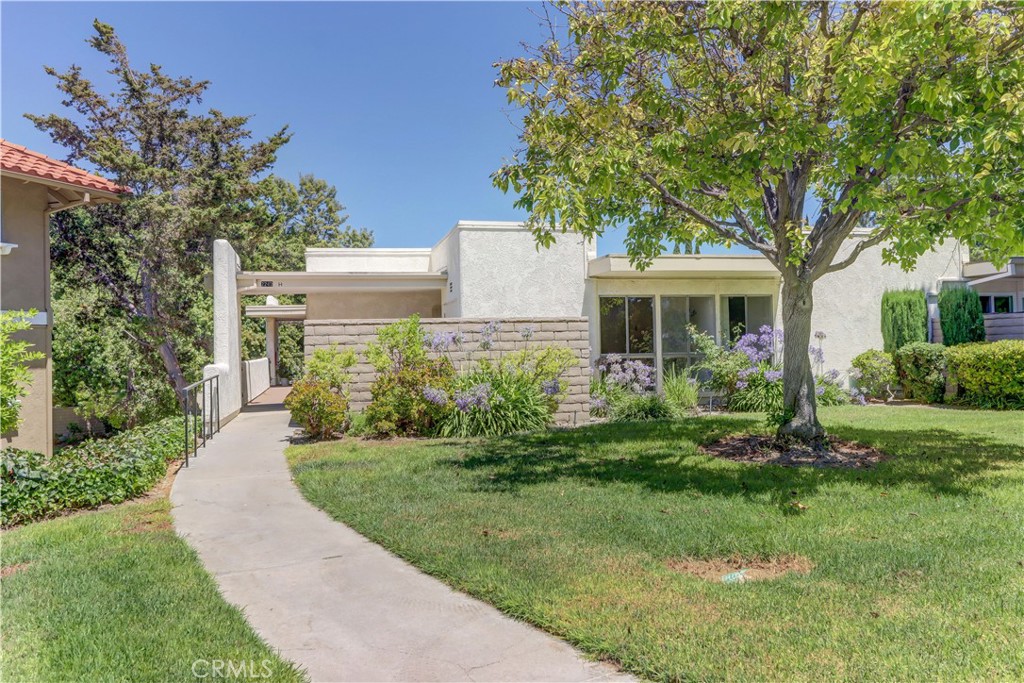 Great value CONDO!! "Monterey" floorplan with no steps, no one above or below and large, sunny patio with huge storage closet. Easy access to Gate 6 and Clubhouse 4. Freshly painted and brand new water heater. Bright living room with view of the greenbelt through 2 good sized windows. Arched accent walls in dining area with ceiling fan light. Kitchen countertop is updated and the space has a large skylight. Bedrooms are on separate sides of the home and brightened thanks to the large windows and mirrored closet doors. Bathroom area houses fiberglass tub/shower combo and Solartube. Flooring is a combination of carpet in bedrooms, vinyl in living room and tile in kitchen/bath/traffic path. Close to carport! Just a short drive to Clubhouse 4 to take a free Emeritus class at the creative center of Laguna Woods with workrooms and classes in pottery, jewelry making, slip casting plus an awesome wood shop, painting studio with amazing lighting and huge sewing/quilting room. There is an Olympic size pool with hot tub and locker room. This condo provides an affordable option within Laguna Woods and there is non-warrantable condo FINANCING available. Laguna Woods Village residents enjoy a 27-hole championship golf course, a 9-hole executive par 3 course, pickleball and tennis courts, lawn bowling, gyms, clubhouses, swimming pools, horse stables, gardening centers, artist studios, computer workrooms and classes + over 200 clubs and organizations.