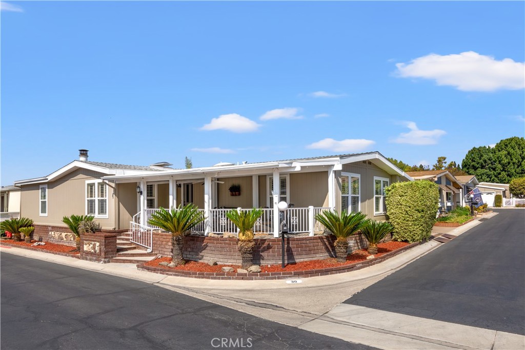 Welcome to The Groves – a vibrant 55+ active community nestled in the heart of Irvine! NO SPACE RENT and a gated entrance with an attendant 24/7!! Step into this charming corner-lot home that offers both comfort and style. With 2 spacious bedrooms, 2 bathrooms, a dedicated office, and a separate den (that was previously a 3rd bedroom), there’s room to relax, work, and entertain. The thoughtfully designed layout features the primary suite on one side of the home, creating a peaceful retreat, while the additional rooms are tucked away on the opposite end for added privacy. Inside, you’ll find warm vinyl flooring, elegant crown molding, and beautifully crafted baseboards. The large kitchen is a true highlight, featuring granite countertops, abundant storage, and a center island with barstool seating – perfect for casual meals or gathering with friends. The living room boasts vaulted ceilings and a cozy fireplace, creating an inviting space to unwind. Natural light pours in through skylights in both the living room and bedroom, adding a bright and airy touch throughout the home. The Groves apart is its remarkable sense of community and wide array of amenities designed to support an active, fulfilling lifestyle. From spontaneous morning walks to planned social gatherings, the community spirit here is genuine, welcoming, and alive. Amenities include: A recently renovated year-round heated pool & spa, gym, sauna, Pickleball, tennis, and basketball courts, putting green, lawn bowling, a beautiful clubhouse with banquet facilities and lounge areas, game rooms featuring Ping Pong, Billiards, and Poker tables, a ceramic studio and fully-equipped woodshop for creative pursuits. There are also a community garden, an on-site hair salon and community BBQ areas with outdoor seating. Additionally, there is RV parking, a dedicated car wash area, and so much more. A full-time on-site management team and activities coordinator ensure a robust community calendar packed with clubs, themed events, volunteer opportunities, and group outings. Whether you're looking to stay fit, explore hobbies, meet new friends, or simply enjoy a vibrant social life, The Groves makes it easy. Low monthly maintenance fees and discounted Cox TV and Internet services make living here as practical as it is pleasurable. Come experience the warmth, comfort, and community The Groves has to offer – your next chapter begins here!