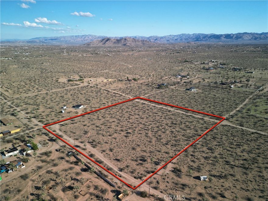 Prime 10.54 acres in Yucca Mesa with water and power in the street, just off a paved road. Mature Joshua Trees, mountain views, and open desert landscape make this an ideal spot to build your home, ranch, or retreat. Large homes nearby, yet this expansive parcel offers plenty of privacy. Minutes to Yucca Valley, Joshua Tree, and local attractions. A great opportunity to create your desert lifestyle.
