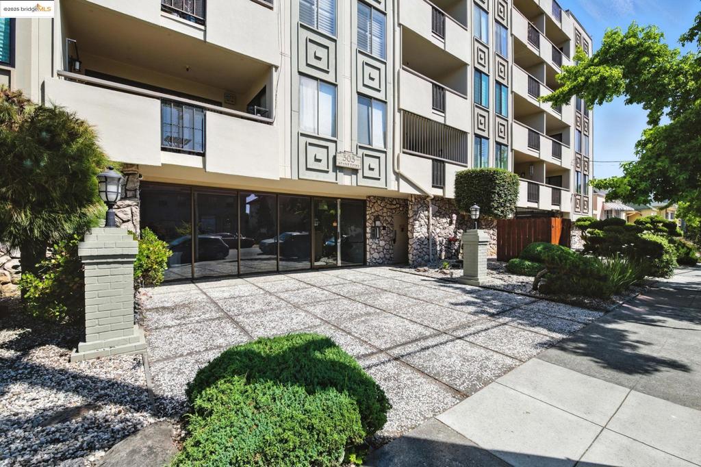 Welcome to your Bay Area oasis! This beautifully kept 1-bedroom, 1-bath unit is ideally situated in Oakland’s sought-after Adams Point. Bright and airy throughout, the home offers a spacious living room with a cozy gas-burning fireplace and direct access to a private patio — perfect for morning coffee or evening unwinding. The balcony opens to both the living area and bedroom, making it the perfect place to enjoy indoor-outdoor California living. Enjoy meals and entertaining in the dedicated dining area, and cook with ease in the kitchen featuring granite counters. The expansive primary suite is a true retreat, complete with an ensuite bathroom, separate vanity area, and private patio access. Primary bedroom could also allow a perfectly inspiring home office, offering light from both windows. Additional highlights include a secure, deeded garage parking space — though with an 84 Walk Score® and 76 Bike Score®, you may rarely need your car. Whole Foods, Sprouts, Lake Merritt’s serene Botanical Garden, the 19th St. BART station, and the historic Fox, Paramount, and Grand Lake Theaters are all within a mile. Surrounded by a growing number of restaurants, coffee shops, and breweries, this vibrant neighborhood has a buzz, and something for everyone.
