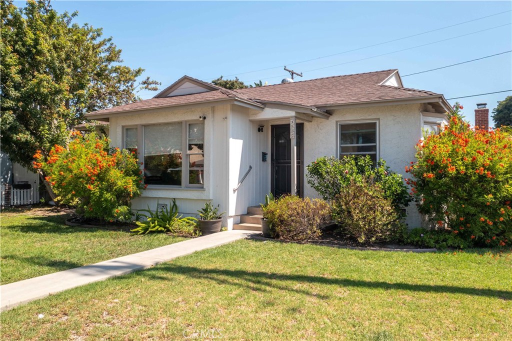 Charming Lakewood corner-lot cottage with endless possibilities! This beautifully maintained property is currently set up as two separate living spaces: a 2 bed/1 bath main home and a spacious 1 bed/1 bath attached unit. Live in one and rent the other, rent both, or easily enjoy it as a single-family residence—the choice is yours! Call for rental amount...
The main home features original oak plank hardwood floors, an open-concept kitchen with butcher block counters and center island, a large pantry, and sunlit dining area with French doors opening to a private patio. Painted inside and out a few years ago! Bright bay windows, lush greenery, and natural light create a warm and inviting atmosphere throughout.
The attached unit offers its own private entrance, a modern kitchen, oversized soaking tub and separate shower, cozy brick fireplace, dual-pane French doors, and walk-in closet. French doors open to a serene, fully landscaped backyard—perfect for entertaining or quiet relaxation.
Additional highlights include: solar panels (owned—low electric bills!), upgraded bathrooms, purified water system, attic insulation, automated sprinklers, and multiple private patios surrounded by mature trees and flowering foliage. Delivered vacant at close of escrow.
An incredible opportunity for multi-generational living, income potential, or the perfect single-family retreat—all minutes from freeways, schools, shopping, and parks.