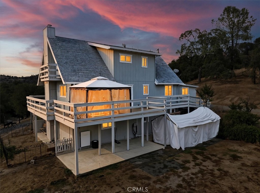 Discover this exceptional 4 bedroom, 2.5 bathroom home situated on the picturesque 3974 Usona Road in Mariposa, California. This beautifully appointed 2264+/- sq. ft. residence offers an ideal blend of comfort and functionality, perfect for those seeking a peaceful retreat with modern conveniences. The generous lot size provides abundant space for outdoor enthusiasts and families alike. The expansive outdoor area features established fruit trees, including nectarine, peach, apricot, and apple varieties, creating your own private orchard. The large usable land offers endless possibilities for gardening, recreation, or simply enjoying the stunning natural views that surround the property. A seasonal creek meanders through the grounds, adding tranquil sounds and natural beauty to your daily experience. The property welcomes chickens and farm animals, making it perfect for those interested in sustainable living or hobby farming. An on-site workshop provides excellent space for projects, storage, or creative pursuits. Modern sustainability features include two Tesla backup batteries, ensuring reliable power and energy independence. The home's location offers the perfect balance of privacy and accessibility, with breathtaking views creating a serene backdrop for daily life. Adventure seekers will appreciate the proximity to world-class outdoor recreation. The renowned Yosemite National Park lies nearby, offering hiking trails, waterfalls, and iconic granite formations. Bass Lake provides water sports and fishing opportunities, while the Merced River offers exciting rafting adventures and additional hiking trails. This property represents a unique opportunity to own a slice of California's natural beauty while enjoying modern amenities and sustainable features. The combination of spacious indoor living, extensive outdoor space, agricultural potential, and proximity to recreational destinations makes this home particularly appealing for those seeking an active lifestyle surrounded by nature's splendor.