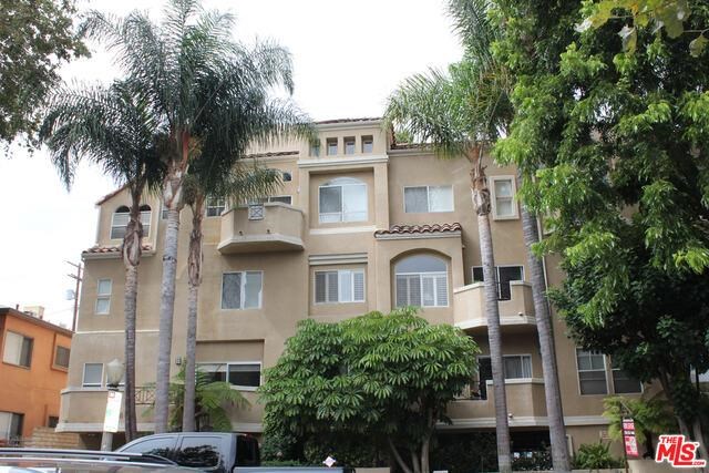 Ideal location! Walk to Trader Joe's, Joan's on Third, the best block of Ventura Blvd and Carpenter Elementary! Walk into the entryway of this contemporary second-floor end unit past the formal dining area with coffered ceiling and custom lighting to an open living room and a separate den area with a cozy fireplace. Large balcony overlooking the pool. A generous amount of windows allow in tons of natural light. The kitchen has granite counter-tops and stainless steel appliances. The bedrooms are located on opposite sides for maximum privacy. The spacious master suite features a large walk-in closet, bathroom with oversized jet tub and dual vanity sinks. The 2nd bedroom is well-sized and offers two closets. Wood flooring in the dining and living room. The unit includes washer and dryer, two tandem parking spaces in a secure garage with guest parking. The building features a heated pool and gym, and is built around a center court garden and maintained by a professionally managed HOA. Within walking distance of the CBS Studio Center, Trader Joe's, Studio City Farmer's Market and some of the best bars, restaurants, and shops in Los Angeles. Close to 101 freeways, downtown, and a short drive over the hill to West Hollywood and Beverly Hills. Amazing location - walk to shops, farmer's market, Trader Joe's and restaurants on Ventura. Light, bright and spacious unit with lots of windows.
