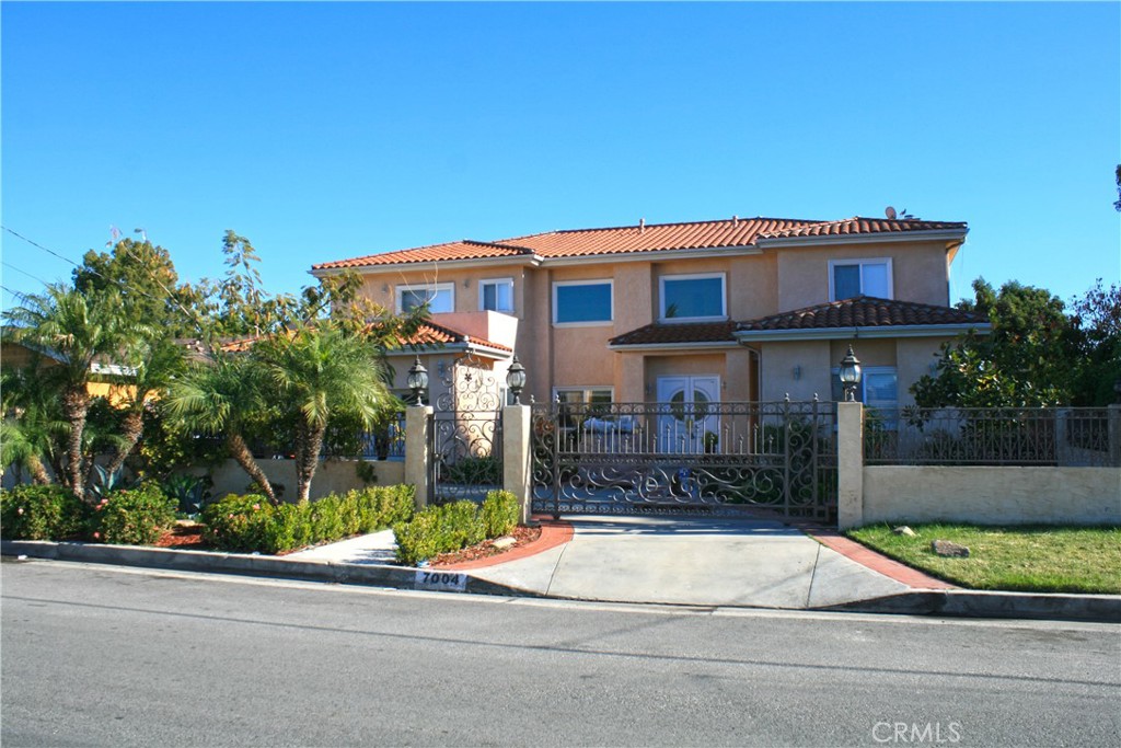 Available for Lease!! Gated North Hollywood Estate offering 5 Bedrooms, 4.5 Bathrooms, and almost 4800 Square Feet of Living Space on a Large 12,900+ Square Foot Lot with Automatic Circular Gates, plus an Attached 2 Car Garage! Low Maintenance Front Yard leads to a Formal Entry Way with Tile Inlays, Dramatic Stairway and Chandelier. 3 Fireplaces warm the Living Room, Family Room and the Primary Suite. Entertain Easily with a Wonderful Formal Living Room, Formal Dining, an Open Family Room that Looks over the Center Island Granite Cooks Kitchen with Breakfast Bar, and there’s even a Home Office. Almost all the bedrooms are en-suites with Private Bathrooms, and Two of the Upstairs Bedrooms share a Jack n’ Jill Bath, plus there’s a Convenient Downstairs Bedroom + Bath, and Indoor Laundry. Expansive Primary Suite with Sitting Area, Balcony, Custom Walk-in Closet and Beautiful En Suite Bath. Large Rear Yard with BBQ Center, Covered Patio, Fruit Trees and plenty of room to Entertain. Additional Amenities Include: Central Air & Heat, Dual Pane Windows, Recessed Lighting and More. It’s a Must See!