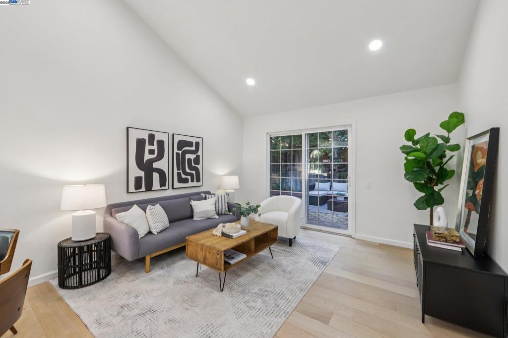 Welcome to this beautifully updated single-family duet home on a prime lot with a larger backyard than others in the community. This light-filled home features an open floor plan with vaulted ceilings, engineered hardwood floors, dual-pane windows and sliding doors, new LED recessed lighting throughout, Quartz countertops, new Samsung stainless steel appliances, and fresh interior paint. Roof will be replaced prior to escrow closing. The layout includes two spacious primary suites—one downstairs with direct access to the backyard, and another upstairs with a private bath, large closet, and office nook ideal for remote work or study. A flexible loft offers potential for a third bedroom. Enjoy a generous backyard with a low-maintenance teakwood deck, perfect for entertaining or relaxing. Additional highlights include an attached garage, carport, central heating, and low HOA dues of $36.43/month. Conveniently located near BART, Kaiser Hospital, Fremont HUB, the Fire Department, San Jose Airport, and top-rated schools. This home offers comfort, style, and an unbeatable location in one of Fremont’s most desirable neighborhoods.