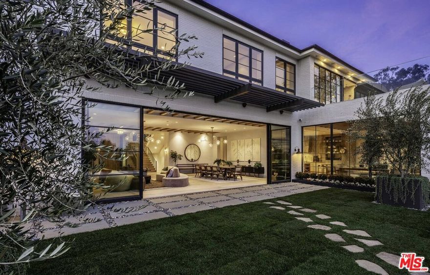 A beautiful Contemporary Estate located in the extremely desirable Huntington neighborhood of Pacific Palisades. Privately nestled behind gates with breathtaking views of the Pacific Ocean and lush Santa Monica Canyons. Designed and built by renowned developer/designer couple David and Eliana Rokach. Conveniently located moments from the new Pacific Palisades Caruso Village, as well as popular hiking trails and the scenic beaches of Santa Monica.