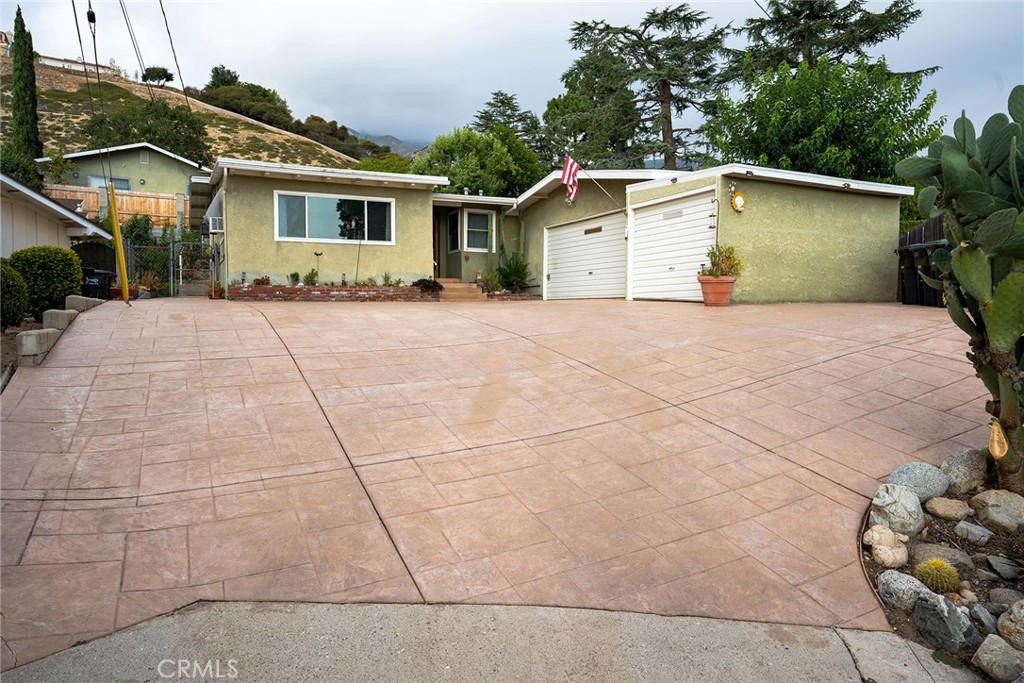 TRUST SALE Single story nestled in highly sought after La Crescenta at the top of quiet cul-de-sac in Crescenta Highlands area above Santa Carlotta. An unbeatable location with mountain views. This home features 4 bedroom and 2 baths and family room. Bathroom with soaking tub along with double sinks and the Kitchen offers all built in with granite kitchen counters, wood floors and adjacent laundry facilities in enclosed closet area. Other features include central air and heat. All rooms are bright and airy. Livingroom leads out to a private all fenced in back yard. Attached garages, consist of a 2 car and a single car garage with ample parking within the front concrete driveway space. Located near parks, shopping and enjoy the Glendale/La Crescenta Blue Ribbon schools. TRUST SALE: Sold as-is