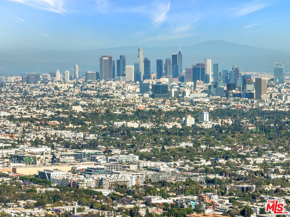 Elegant Mid-Century Home with Stunning City Views in Prime Hollywood Hills. Available for lease, this beautifully maintained 4-bedroom, 3-bathroom Mid-Century home offers 2,111 square feet of luxurious living space on a generous 12,753 square foot lot. Located in the highly coveted Hollywood Hills, this residence perfectly combines timeless architectural charm with modern amenities. Inside, an open, airy floor plan is complemented by floor-to-ceiling windows that flood the home with natural light and frame breathtaking panoramic city views. The spacious living areas offer an ideal setting for both relaxed living and sophisticated entertaining, while the chef-inspired kitchen features high-end appliances and sleek finishes, perfect for culinary enthusiasts. The private outdoor space is an entertainer's dream, with a beautifully landscaped front yard that offers ample room for outdoor dining, lounging, and enjoying the tranquility of your surroundings. Whether you're unwinding with the sunset over the city skyline or hosting intimate gatherings, this home provides an exceptional backdrop for luxury living. Located in one of Los Angeles' most desirable neighborhoods, this Hollywood Hills gem is available for lease. Schedule a private showing today to experience this rare and stunning property.