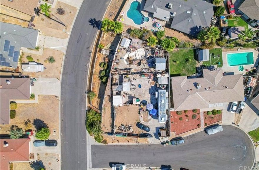 Calling all investors and dream-home builders—don’t miss this incredible opportunity! This spacious 10,019 sq ft corner lot is located at the end of a quiet cul-de-sac in a well-established neighborhood, offering the perfect setting for your next project. The property previously featured a 3-bedroom, 2-bathroom, 1,644 sq ft single-story home, which has been lost to a fire. However, the foundation remains intact, and utilities are available. An in-ground pool and jacuzzi are also still in place, offering added value. Whether you’re looking to build your dream home, construct a spec house, or place a manufactured/mobile home, the possibilities are wide open. Buyers are encouraged to conduct their own due diligence with the city to confirm zoning and development options. Bring your vision and your contractor to transform this blank canvas into something remarkable!
