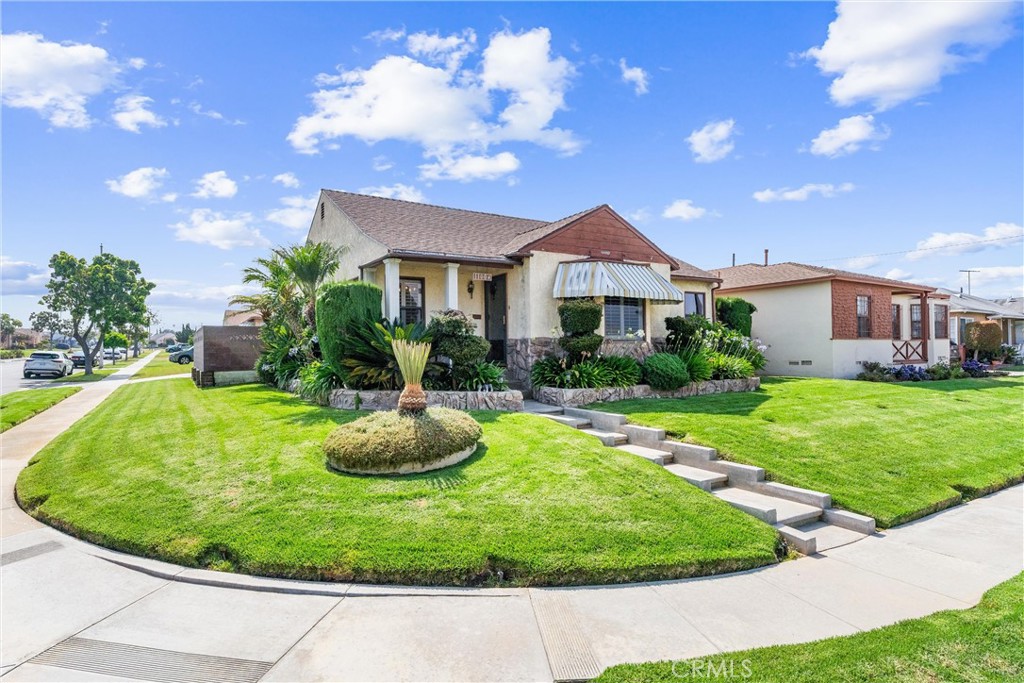 Welcome to 11004 S Van Ness Avenue, a spacious and well-maintained 2-bedroom, 2-bathroom home offering 1,563 sq ft of living space on a 5,942 sq ft lot. Located in the culturally rich Westmont neighborhood of Los Angeles. This inviting residence blends timeless character with tasteful updates. The kitchen showcases granite countertops, custom cabinetry, stainless steel appliances, a breakfast nook, and a convenient laundry area. The light-filled living room features original hardwood floors, crown molding, and connects seamlessly to a formal dining area, ideal for entertaining. Both bathrooms are clean and classic, with one featuring a separate soaking tub and walk-in shower. The spacious family room boasts a skylight, wood flooring, and sliding doors that open to a covered patio and private backyard—perfect for indoor-outdoor living. A detached 2-car garage and well-manicured front yard complete this charming property. Close proximity to Van?Ness Recreation Center, Chesterfield Square Park, Century Park Elementary, George?Washington Prep, and a variety of shops and services along Florence and Crenshaw ensure daily convenience. Quick freeway access brings Downtown L.A. and LAX within easy reach. 11004 Van?Ness offers the perfect blend of comfort, history, and connectivity in a flourishing neighborhood.
