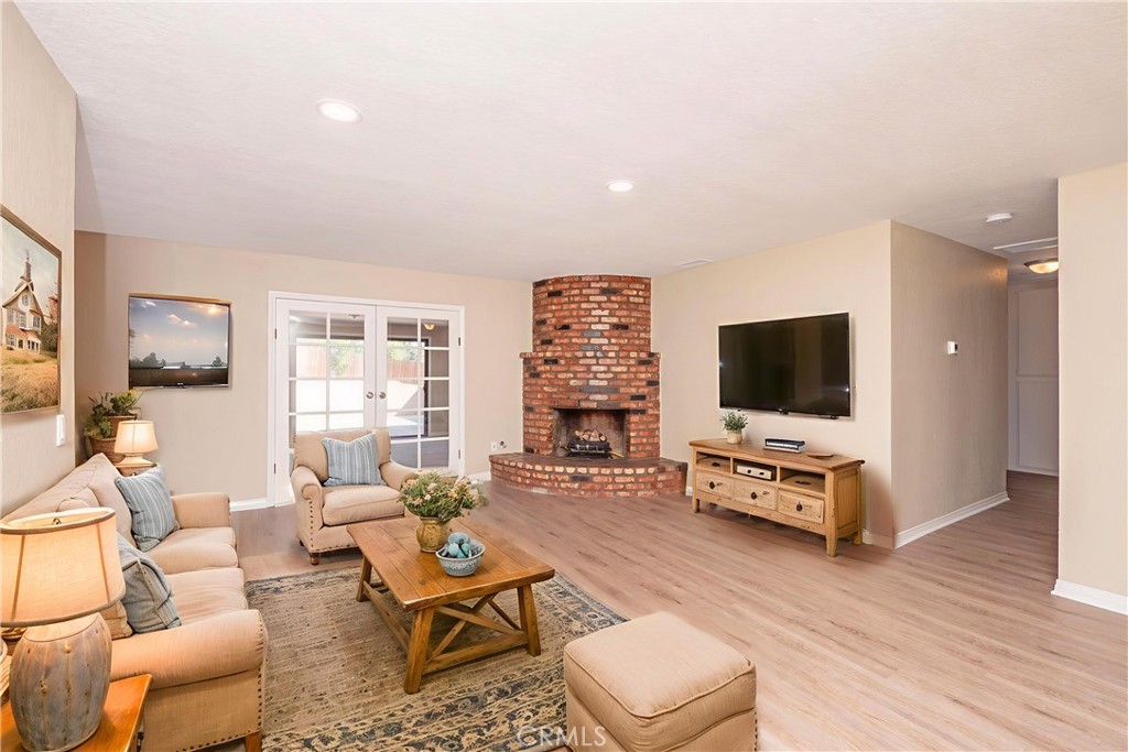 Welcome to this inviting ranch-style home in Jurupa Valley where comfort, updates, and convenience come together. Offering 3 bedrooms, 2 bathrooms, and expansive bonus spaces, the single-story layout is designed for everyday living and entertaining. Inside, you’ll find fresh paint, new vinyl plank flooring, new quartz countertops, and new stainless steel appliances that bring a modern touch. The living room’s cozy gas fireplace sets the scene for relaxing evenings, while the oversized bonus room with pellet stove opens to the backyard, creating the perfect spot for gatherings. A separate room with a built-in hot tub provides a private retreat to unwind after a long day. Thoughtful upgrades like a newer stainless steel kitchen sink, faucet, garbage disposal, new carpet, new recessed lighting, new ceiling fans, new ductwork, new attic insulation, and a newer HVAC condenser add peace of mind. Outdoors, newly painted trim throughout, freshly sodded lawn, new irrigation sprinkler system with timer and drip line in front yard, accent landscaping & new lighting make a welcoming first impression, and the spacious backyard offers plenty of room for entertaining, gardening, or future projects. With schools, shopping, parks, and major freeways just minutes away, this home blends updates, function, and an easy-going lifestyle in one move-in-ready package.