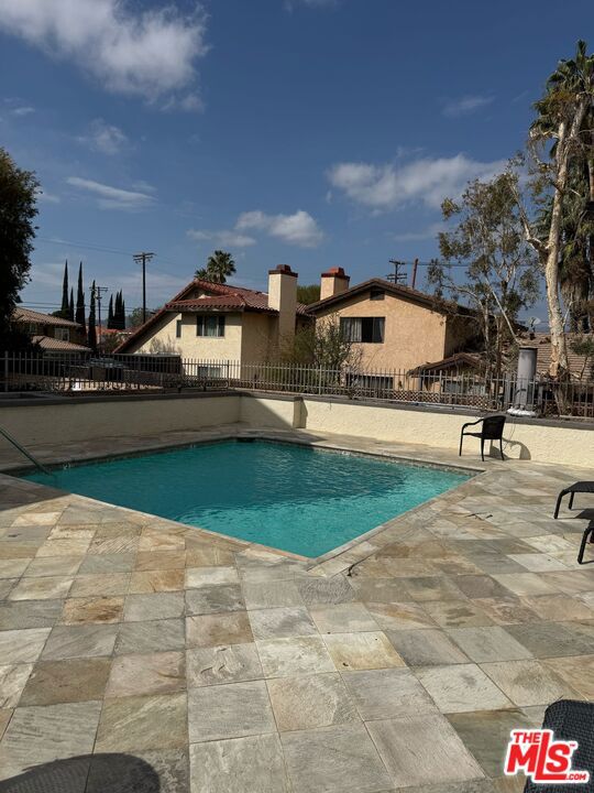 A Rare Gem! Step into luxury and exclusivity as you enter this stunning Terramar residence! From the moment you arrive, you'll be captivated by the soaring high ceilings, inviting fireplace, and seamless indoor-outdoor flow that leads to your private patio oasis.The modernized kitchen shines with sleek updated counters, fresh paint, and radiant recessed lighting, making it the perfect space to whip up your favorite meals. The spacious bedroom and expansive bathroom offer ultimate comfort, while the in-unit washer and dryer hookups add unbeatable convenience!Indulge in the exclusive amenities of the Terramar community, including a sparkling pool, state-of-the-art gym, serene outdoor spaces, and the ultimate privacy of a gated parking garage with two tandem parking spaces just for you.Nestled in a prime location near Pierce College and endless entertainment, this rare find won't last long! Don't miss your chance to call Terramar home!