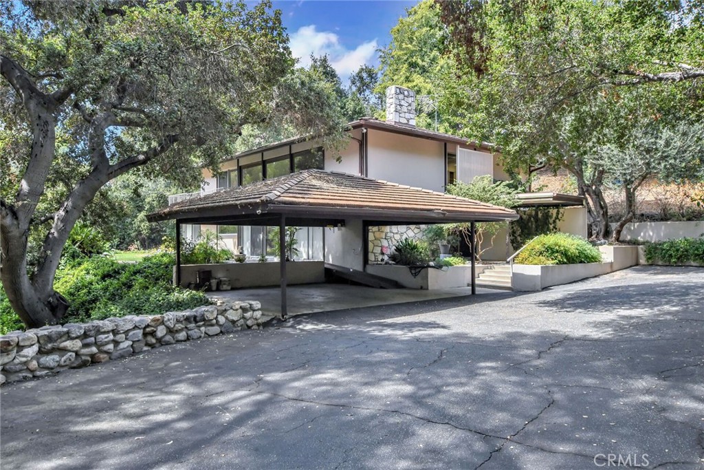 Nestled in prestigious Covina Hills and perched on the banks of a picturesque dry creek bed you will find this one of a kind home with a view from every room, and located within the coveted South Hills school system. The owners purchased the land, almost an acre, then designed and built this custom home and have enjoyed it for years.
Features of this unique property include: great curb appeal, privacy plus, a mountain-like setting, lush mature landscaping, an open and airy floor plan, a living room with a fireplace, a separate family room/den (downstairs), a kitchen with built in appliances and breakfast area, a large main bedroom with a four fixture bathroom, an indoor laundry room, and a HUGE storage room. Other features include: high ceilings, oodles of storage, central heating and air conditioning, and recessed lighting.
This home is close to shopping, restaurants, transportation, fast food, equestrian & hiking trails, Walnut Creek Wilderness Park, Via Verde Country Club and Golf Course, Bonelli Regional Park with fishing & swimming & boating, Raging Waters water park, and is easily accessible to the 10, 57, and 71 freeways. Please click on the Virtual Tour to see the 3D floor plan.