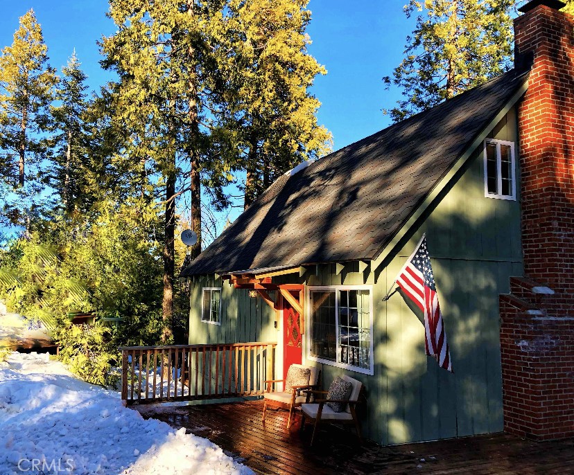 : Discover your perfect mountain retreat with this beautifully updated 3-bedroom, 1.5-bathroom cabin in the desirable East Village of Shaver Lake, CA. Spanning 960 sq. ft. on a spacious 8,145 sq. ft. lot, this fully furnished gem is a proven vacation rental, complete with its successful rental calendar for seamless income potential or personal enjoyment. Step inside to a bright, modern interior featuring a fully renovated kitchen, perfect for preparing meals. The open-concept living area boasts a cozy wood-burning fireplace with a blower, ideal for cozy Sierra evenings. Updated waterproof flooring flows throughout, paired with central heat for year-round comfort. Recent upgrades include a new deck, roof, and windows, ensuring low maintenance and lasting charm. Unwind in the private 2-person spa under the stars or relax on the spacious deck, surrounded by serene Sierra views. Just a 15-minute walk to Shaver Lake and a 6-minute stroll to Shaver Lake Pizza, this East Village cabin offers easy access to boating, fishing, hiking, and skiing at nearby China Peak Ski Resort. This turnkey property is a rare opportunity for investors or vacation home seekers. Schedule a viewing today to claim your Shaver Lake oasis!