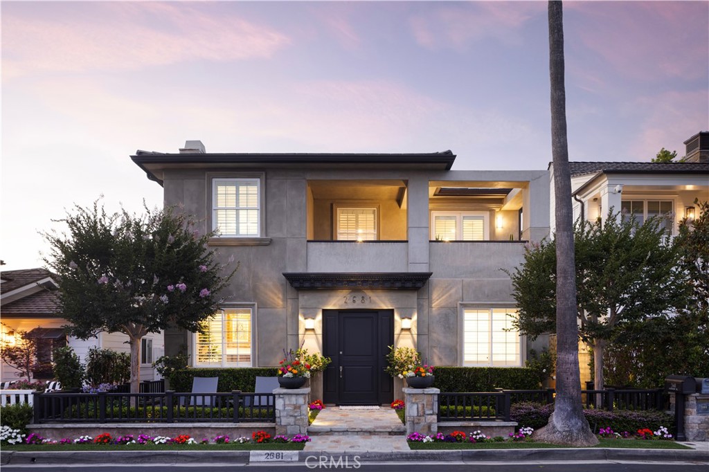 Tucked within the prestigious guard-gated enclave of Bayshores, this custom residence offers refined coastal living in one of Newport Harbor’s most exclusive bayfront communities. Thoughtfully designed to blend timeless elegance with contemporary sophistication, the four-bedroom, five-and-a-half-bath home spans over 4,400 square feet of living space—offering generous scale and an ideal floor plan for both entertaining and relaxed everyday living. From the moment you enter, the interiors impress with rich textures, custom millwork, and curated design elements throughout. At the heart of the home lies the gourmet chef’s kitchen, appointed with a large center island, Wolf 60” dual oven range with pot filler, SubZero Pro refrigeration, and three wine refrigerators—tailored for culinary enthusiasts and gracious hosts alike. The kitchen flows effortlessly into the inviting family room and out to a covered patio with built-in barbecue and outdoor dining. Additional main-level highlights include a formal living room with fireplace, dining room with coffered ceilings, a versatile home office, a fully equipped theater, and a spacious three-car garage outfitted with a tool bench, refrigeration drawers, and ample storage. Upstairs, the luxurious primary suite serves as a tranquil retreat with its own balcony, sitting area and fireplace, along with a newly reimagined spa-inspired bathroom featuring a freestanding soaking tub, generously sized shower, dual vanities, and thoughtfully curated storage throughout. Three additional en-suite bedrooms, including a VIP suite, offer comfort and privacy for family and guests, with one bedroom currently styled as a bespoke designer closet. A large laundry room completes the second level. Smart home features include central air conditioning, a whole-house water filtration and softener system, intelligent LED lighting, and integrated audio throughout. Residents of Bayshores enjoy 24-hour security, two private sandy bay beaches, a marina, playground, and exclusive pedestrian access to the Balboa Bay Club. Ideally situated near world-class dining, shopping, and award-winning schools, this is a rare opportunity to experience the very best of Newport Beach living. *Seller willing to consider buyer concessions if requested in offer*