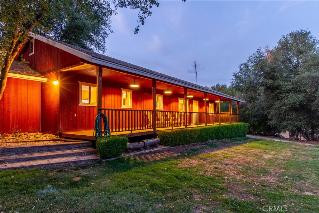 Miners Town - you're going to love this property with so many possibilities. Two Homes! Located on almost 2.5 acres in Ahwahnee with views. The property has quaint out buildings with a mining town motif, including a 1 bed, 1 bath cabin with kitchen and covered porch. You could make the 3 bed, 2 bath home your permanent residence, use the cabin as your guest house, while renting it on Airbnb to generate revenue when you're not using it. Or, it could be a great multi-generation setup if you have grown children or parents that need their own space. If you're looking for investment property, the whole property can be short term rented to generate significant revenue with different listing configurations. The home is nicely furnished and decorated, with a newly remodeled primary bathroom as well as a new hot tub. The furnishings are negotiable, so this could be a turn-key vacation rental just 45 minutes from the South Gate of Yosemite. While county records show 1521 sq ft, based on the floor plans, the home is about 1400 sq ft, and the finished part of the cabin is 380 sq ft, plus the unfinished portion is another 380 sq ft. Buyer to confirm.