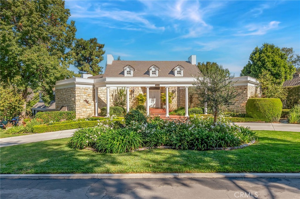 This is one of Long Beach's finest estates overlooking the 11th Fairway of the Virginia Country Club Golf Course. Once you enter through the private gates, you will feel as though you have left the city and entered into a lush forest surrounded by trees and greenery. As you approach the residence, you will have abundant parking on the circular drive and direct access to the 3 car garage. Walk through the front double door main entry to be awed by the central Rotunda staircase with floor to ceiling windows looking out to the rear grounds and golf course. The original building permits show that the estate was designed by the renowned architectural firm of Gene Verge and R.N. Clatworthy. Expansive primary suite with fireplace, ensuite bath and tons of closet space. There are a total of 6 bedrooms and 5 of them have ensuite baths. Enormous living room, family room, formal dining room, dining nook, craft room, gourmet kitchen with island. The home is detailed with crown moldings, custom wainscoting in many rooms, coffered ceiling in great room, wet bar, 3 car garage, office, two stair cases, stained glass window, gated pool with spa and waterfall/slide. The parklike grounds include an orchard with over 20 fruit trees. This home is in pristine original condition with many additional details