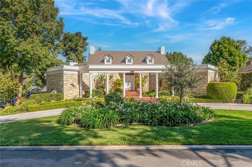 This is one of Long Beach's finest estates overlooking the 11th Fairway of the Virginia Country Club Golf Course.  Once you enter through the private gates, you will feel as though you have left the city and entered into a lush forest surrounded by trees and greenery.  As you approach the residence, you will have abundant parking on the circular drive and direct access to the 3 car garage.  Walk through the front double door main entry to be awed by the central Rotunda staircase with floor to ceiling windows looking out to the rear grounds and golf course. The original building permits show that the estate was designed by the renowned architectural firm of Gene Verge and R.N. Clatworthy.  Expansive primary suite with fireplace, ensuite bath and tons of closet space.  There are a total of 6 bedrooms and 5 of them have ensuite baths. Enormous living room, family room, formal dining room, dining nook, craft room, gourmet kitchen with island.  The home is detailed with crown moldings, custom wainscoting in many rooms, coffered ceiling in great room, wet bar, 3 car garage, office, two stair cases, stained glass window, gated pool with spa and waterfall/slide.  The parklike grounds include an orchard with over 20 fruit trees.  This home is in pristine original condition with many additional details