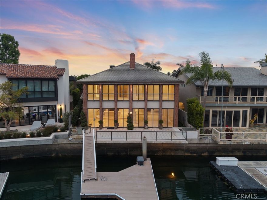 FAMILY TRUST AUCTION!!! SET BEHIND SECURITY GATES IN NEWPORT BEACH IN THE INTERIOR PRIVATE COVE ON COVETED LINDA ISLAND, IS A CHANCE TO PURCHASE ONE OF THE ISLAND’S MOST DESIRABLE PARCELS. POSITIONED ON A GENEROUS 7,500± SQ. FT. LOT, THIS EXCEPTIONAL PROPERTY OFFERS THE SCALE, PRIVACY AND ORIENTATION TO RESIDE IN ONE OF NEWPORT BEACH’S MOST ICONIC COMMUNITIES. THIS PROPERTY CAPTURES AWE-INSPIRING BAY VIEWS THAT STRETCH WESTWARD, DELIVERING A CINEMATIC BACKDROP FOR SOUTHERN CALIFORNIA’S FAMED BEACH COMMUNITY LIVING. AS YOU ENTER THE TWO STORY COMPOUND AND PASS THROUGH A GATED, PRIVATE COURTYARD, YOU ARE GREETED WITH A GRAND STRIKING AND SWEEPING CIRCULAR STAIRCASE, SOARING CEILINGS AND AN EASY FLOW INTO A SPACIOUS LIVING ROOM WITH INNER LAGOON VIEWS. THIS IMPRESSIVE 5 BEDROOM, 5 BATHROOM HOME COMBINES REFINED ELEGANCE WITH COMFORTABLE LUXURY. A 3 CAR ATTACHED GARAGE, FIREPLACES, WET BAR, GENEROUSLY SIZED UPSTAIRS EN SUITE BEDROOM, FORMAL DINING ROOM AND REMARKABLE CHEF’S KITCHEN WITH CENTER ISLAND, SUB ZERO REFRIGERATOR, BERTAZONI RANGE ARE A FEW OF THE NUMEROUS HIGHLIGHTED ELEMENTS THAT ACCENTUATE THE HOME. DINE AL FRESCO ON YOUR PRIVATE PATIO AS YOU LOOK OUT AT THE TRANQUIL WATER AND 50± FOOT BOAT DOCK. COME EXPERIENCE COASTAL LUXURY LIVING AT ITS FINEST. WELCOME HOME!