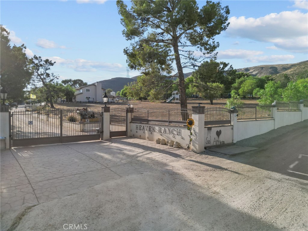 Welcome to 35655 Buckhaven Road, an exceptional equestrian retreat in the heart of Santa Clarita! This 2,815 sq. ft. residence offers 4 bedrooms and 3 bathrooms, thoughtfully designed for both comfort and functionality. Originally built in 1980, the home is set on a sprawling 2.42-acre lot, providing unmatched privacy, versatility, and room to expand.
A rare opportunity for horse lovers and investors alike, this property is equipped with 7 horse stalls, an ADU, and a double-wide—all offering tremendous income-producing potential. Whether you’re boarding horses, leasing additional living space, or creating a multi-generational compound, the options are as limitless as the land itself.
Entering through a private electric gate, you’ll find a secure and serene setting, enhanced by a brand-new generator for peace of mind and uninterrupted comfort year-round. Central heating and cooling keep the interiors inviting, while the generous layout offers flexible living for families and extended guests.
Outside, the acreage provides ample room for arenas, trailers, and future expansions—making it ideal for equestrian training, events, or simply enjoying wide-open spaces. With abundant parking and thoughtfully designed outbuildings, the estate blends practicality with lifestyle, catering to both personal enjoyment and business opportunities.
Whether you envision a self-sustaining horse property, a private family retreat, or an investment with strong income potential, 35655 Buckhaven Road offers a unique chance to own one of Santa Clarita’s most versatile estates—where equestrian living and financial opportunity come together.