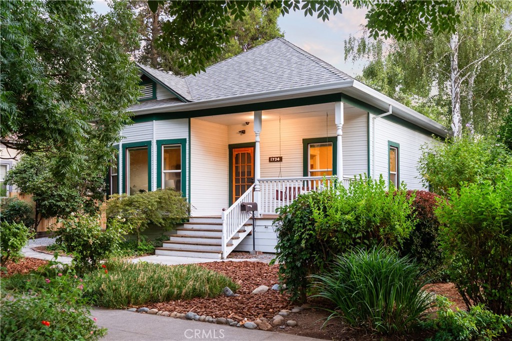 Overflowing with charm and character, this delightful property blends its original personality with thoughtful modern updates. From the moment you step inside, you’ll be captivated by the beautiful hardwood flooring, classic built-ins, soft neutral walls, 10 ft ceilings and an abundance of windows that fill the home with natural light. The formal seating area flows effortlessly into the dining room, creating an ideal space for hosting gatherings with ease. The kitchen is both functional and full of charm, offering ample cabinetry, sleek quartz countertops, eye-catching brick accents, and a gas range that makes meal prep simple and enjoyable. For cozy evenings, retreat to the separate living room, complete with a woodstove surrounded by classic brickwork—a perfect spot to unwind. Each bedroom provides generous space, complete with nicely sized closets for all your storage needs. The modern, refreshed bathroom is designed for both style and convenience, featuring dual sinks and a large, tiled walk-in shower to simplify your morning routine. Need extra space? The basement is there to store all your extra belongings. Additional amenities include ceiling fans throughout, a separate indoor laundry area with utility sink and storage, owned solar, an oversized detached one-car garage, and a low-maintenance backyard perfect for casual outdoor entertaining. Tucked just minutes from Downtown Chico—with its quaint shops, fantastic restaurants, and vibrant local events—this home places everything you need within easy reach. Don’t miss the chance to make this charming property yours!