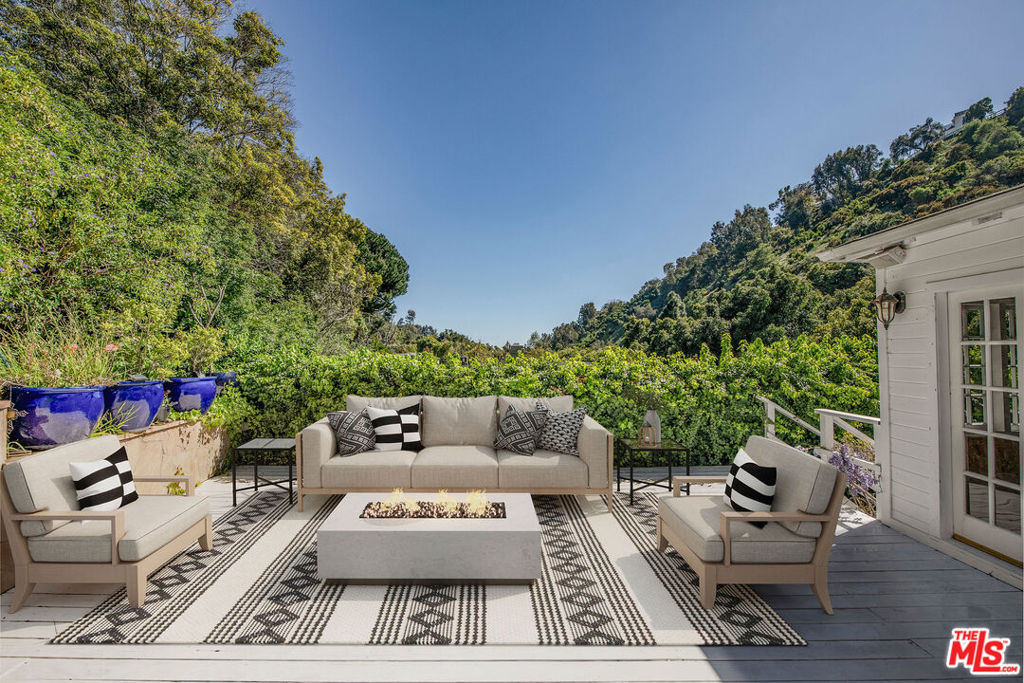 Best deal and opportunity on lower San Ysidro Drive, this exquisite home offers exceptional safety and privacy, along with partial views from the deck, all while being close to Beverly Hills' vibrant nightlife. Located on a prestigious street known for multimillion-dollar homes, this property is a fantastic alternative to a condo and boasts a prime location. Don't miss your chance to own a piece of Beverly Hills paradise! The home could use some upgrades and hence the price reflects the discount for the improvements. This property has great potential for Airbnb and could be perfect for a 1031 exchange. For pricing insights, AIRDNA suggests $570 per night for Airbnb listings in the area. Please conduct your own research. Act now to secure this exceptional investment; perfect for a 1031 exchange also.