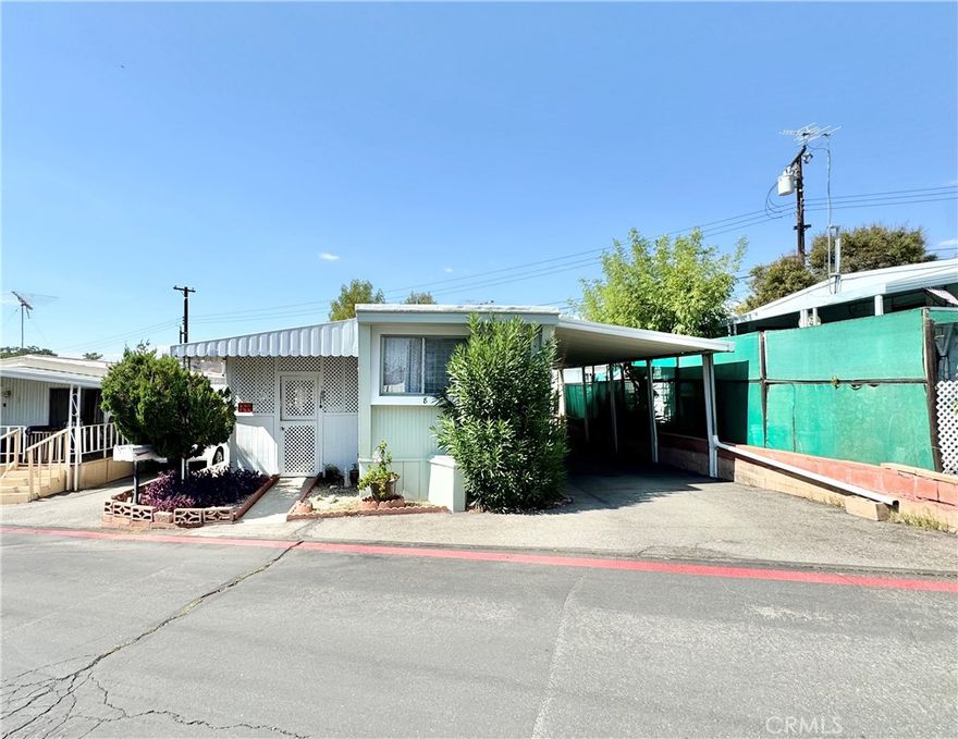 Nestled in the heart of Yucaipa, This Charming, Fully Remodeled mobile home offers the perfect blend of comfort and convenience. Featuring One cozy bedroom with his and her closet. A beautifully New and updated bathroom. The home boasts New Flooring all throughout. New washer and dryer hookup for your in home laundry. The brand-New kitchen is a chefs dream with brand New appliances ready for use. The spacious and covered patio provides an ideal spot for storage, outdoor relaxation and or entertaining. Also Newly added staircases for easy access, Along with fresh New paint job on the exterior, and a 2-Carport storage for your vehicles. With low space rent, this gem is an affordable and delightful urban retreat.