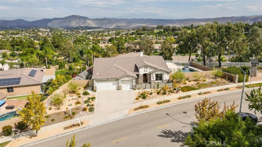 ***See Our Amazing Virtual Tour***Rare Find in Eagle Glen – Elegant Single-Story Retreat! Discover this exceptional single-story treasure in Corona’s prestigious Eagle Glen community. Offering approx. 2,617 sq. ft. of customized living space, this 4-bedroom, 2.5-bath home rests on an expansive 13,000+ sq. ft. lot—a perfect blend of sophistication, comfort, and contemporary design. From the moment you arrive, the drought-tolerant landscaping and impressive three-car garage with upgraded dual doors set the stage for what lies within. Step inside to an open-concept floor plan that radiates luxury and warmth. The formal living room welcomes guests in style, while the designer kitchen shines with high-end cabinetry, quartz countertops, a large center island with seating, and a pantry accented by a sliding barn door. Overlooking the family room, the kitchen flows into a space highlighted by custom built-ins and a cozy fireplace—creating the perfect setting for entertaining or relaxing. A flexible room currently used as an office or gym is separated by a modern barn door, offering both versatility and privacy. On one wing, you’ll find three spacious bedrooms, an upgraded full bath with dual sinks and quartz counters, plus a stylish laundry room and guest powder bath. The privately situated primary suite serves as a peaceful retreat. French doors open to the serene backyard, while the luxurious en suite bath features a massive walk-in doorless shower, quartz counters, and spa-quality finishes. Throughout the home, rich tile flooring, upgraded baseboards, designer paint, enhanced lighting, and ceiling fans create a cohesive, refined aesthetic. Step through the collapsible glass doors to an entertainer’s dream backyard. The covered patio offers panoramic city-light views, while the sparkling pebble-tech pool and spa—framed by new tile—set the tone for resort-style living. A second covered patio adds even more flexibility for gatherings or quiet evenings under the stars. Every inch of this home has been curated for beauty, function, and relaxation. Located within Corona’s premier golf course community, Eagle Glen offers a championship course, clubhouse, and pickleball courts. With nearby shopping and dining at Bedford, The Crossings, and The Shops at Dos Lagos—plus easy freeway access—this is a rare opportunity to own a fully customized single-story masterpiece in one of Corona’s most desirable neighborhoods.