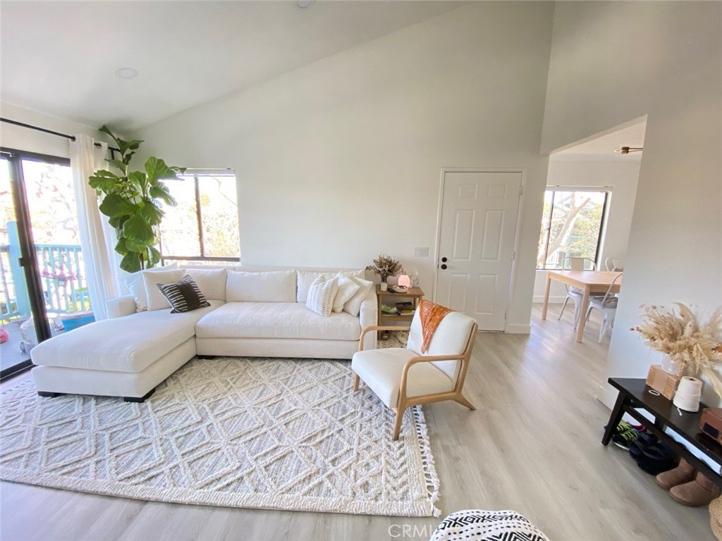 Experience contemporary living in this beautifully renovated upper-level 2 bedroom, 2 bath condo in the desirable Ponderosa West community in Torrance. Step inside to discover an airy, open-concept layout featuring high vaulted ceilings and oversized windows that flood the home with natural light. The expansive primary suite offers a peaceful retreat with abundant space for relaxation. Enjoy tranquil views as you’re surrounded by mature trees, creating a serene and private atmosphere. The community boasts lush landscaped grounds, pool, and spa. Additional highlights include two covered parking spaces, a modern kitchen, and updated spacious bathrooms. Ideally located just moments from major freeways, popular shops, and an array of restaurants, this inviting condo blends comfort with unmatched convenience—ready for you to call it home.