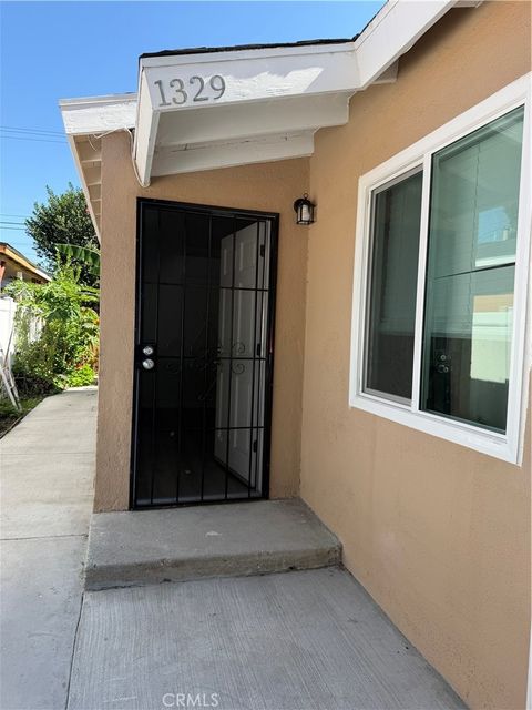 Photo of 1329 E 56th ST, Los Angeles, CA 90011 (MLS # SR26156873)