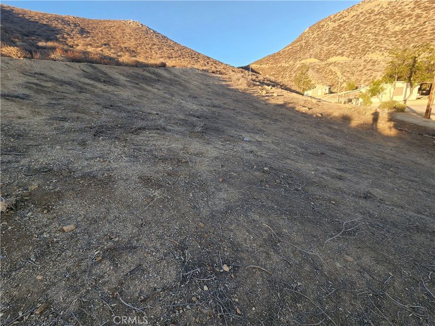 Discover this superb opportunity to secure a 14,810 sq ft (approx. 0.34 acre) lot in the desirable Malaga Road corridor of Lake Elsinore. Conveniently situated near Mission Trail and the I-15 corridor, this parcel offers both future development potential and investment upside. Located within city limits, the lot benefits from nearby shopping, schools, and major road access—yet maintains that more peaceful foothill setting. Buyers should confirm all utilities, zoning, access and building requirements with the City of Lake Elsinore and Riverside County. Build your vision here—or hold for future growth. Don’t miss this rare vacant lot opportunity in a fast-growing region!