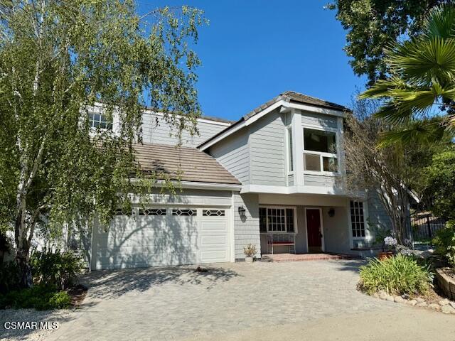 Beautifully updated Westlake estate located at the end of a cul-de-sac on a private flag lot. This updated 4BR/2BA home has been freshly painted with new wood flooring. The kitchen has granite counters, recessed lighting, and stainless appliances including a double oven, warming drawer, gas cooktop, dishwasher, and built-in refrigerator along with an eating area. Formal living room with fireplace & vaulted ceiling and formal dining room with updated lighting. There is a separate family room with built-ins and backyard access. Four upstairs bedrooms including the priary suite with vaulted ceiling, and three closets. Features include inside upstairs laundry area w/washer & dryer, AC, new wood floors, vaulted ceilings, some newer windows/sliders, plantation shutters, built-ins and mirrored closet doors. Entertainer's backyard with pool & spa, patio areas and grass area. The large 13,000+sf lot backs to open space for added privacy. Two car attached garage, at the end of the long, private driveway.