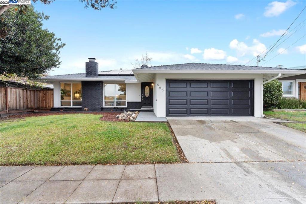 Welcome to this charming single-story home in the desirable Parkmead neighborhood of Hayward. Featuring 3 bedrooms and 2 bathrooms across 1,403 sq ft, this well-maintained residence offers comfort, style, and functionality. Step into a bright, inviting living room with designer SPC flooring and a cozy fireplace. The updated kitchen features quartz countertops, modern appliances, and ample cabinet space, flowing seamlessly into a spacious dining area perfect for family meals or entertaining. The primary suite provides a peaceful retreat with a private en-suite bath and generous closet space. A second full bathroom has been tastefully updated with contemporary finishes. Outside, enjoy a beautifully landscaped backyard with a patio ideal for barbecues, play, or gardening. The expansive lot ensures privacy and potential, while a two-car garage and wide driveway add convenience. Centrally located near top schools, parks, shopping, dining, BART, San Mateo Bridge, and major freeways—this home truly has it all.