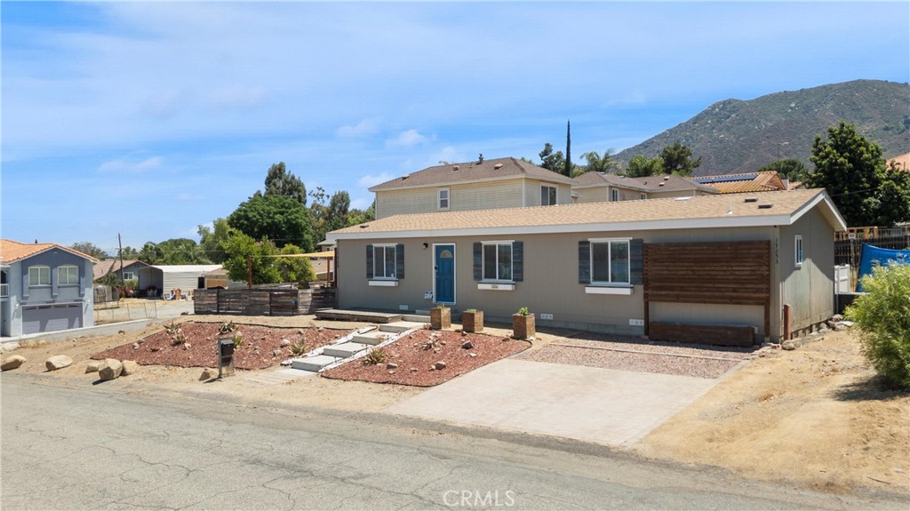 Looking for a move-in ready, reliable, and spacious home in Lake Elsinore for under $500K? You just found it! NO HOA. LOW TAXES. Perfect for a first time home buyer! And here’s a bonus you didn’t even ask for—stunning lake views from multiple rooms, including the living room!
Step inside to a bright and welcoming interior, filled with natural light thanks to large double-pane windows and a sliding glass door. The open-concept layout showcases a spacious living area that flows into a beautifully updated kitchen featuring natural wood tones, timeless white stone countertops, ample cabinetry, generous counter space, and stainless steel appliances.
Down the hall, you'll find a full bathroom with upgraded finishes that match the kitchen, and three bedrooms that increase in size as you approach the primary suite. Two guest bedrooms enjoy peaceful lake views, and the primary offers a spacious retreat with dual sinks, a linen closet, and a shower/tub combo.
The outdoor space is perfect for entertaining and enjoying breathtaking sunsets, complete with a wooden deck for elevated lake views, a shade sail, and a cozy outdoor fireplace. There’s parking for three vehicles, plus RV parking along the right side of the home—and no homes directly in front, giving you unobstructed views of the lake and additional parking options. The front yard is finished with low-maintenance, drought-resistant landscaping.
Situated on a spacious lot with room to grow—add a garage, workshop, or ADU (check with the city for permits). With a permanent foundation, this home qualifies for all types of financing and is ready for you to call it home!