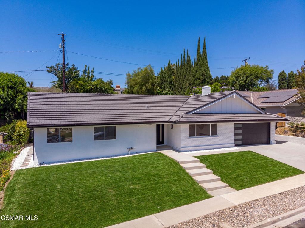 Welcome to this sleek single story pool home in the sought after Conejo Hills neighborhood of Thousand Oaks. This 5-bedroom, 3-bathroom is sure to accommodate all your needs. It has been recently refurbished from top to bottom. Some of the many upgrades include, a newly installed 2025 concrete tile roof, designer front entry door, white oak hardwood flooring, carpet, smooth ceilings, interior doors, baseboards, recessed LED lighting, fresh paint inside/out and rain gutters just to name a few. Spacious open kitchen with clean white cabinetry, center island, breakfast bar seating, quartz counter-tops, tile back splash and matte-colored appliances. Adjoining dining area. Large living room with stacked stone F/P and custom beverage station complete with quartz counter-tops and wine cooler. The primary bedroom offers a nice size walk-in closet. The primary bathroom comes with a walk-in shower, porcelain tile surround, glass enclosure and dual vanity. 4-bedrooms are on one side of the house and the 5th bedroom is on the other end of the house and could be used for office, den or guest set-up, a bathroom is adjacent. The additional hall bathroom is equipped with a tub surround, clean white tile, sliding glass enclosure and a dual vanity! Indoor laundry. The backyard is great for entertaining with a large sparkling pool & spa! Lots of patio area. Newly installed front and rear sprinklers with fresh sod! 2 car garage with newly installed garage door and opener. Great central location within close proximity to schools, hospital, parks!