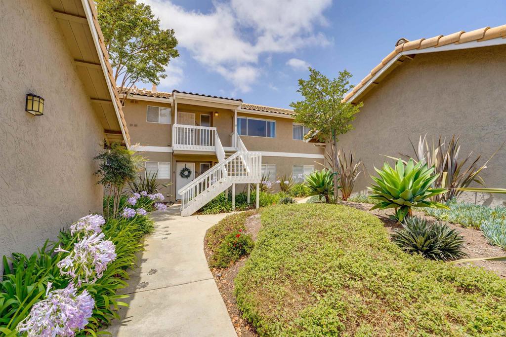 Welcome to this stunning move-in ready top-floor unit situated in a peaceful and meticulously maintained complex. This light and airy home is fully equipped and checks all the boxes for the modern homeowner. Step inside to discover brand new paint and newer luxury vinyl flooring throughout. Soaring cathedral ceilings flood the living space with natural light, creating a warm and open atmosphere that feels like home the moment you arrive. The kitchen features quartz countertops, stainless appliances and custom wood paneling accents on the peninsula, adding a stylish designer touch. Enjoy the comfort of central A/C, the convenience of in-unit laundry, and the privacy of no one living above you. The oversized 2-car garage is located just steps from your front door and provides ample storage and easy access. Conveniently located near Sprouts Market and the vibrant Vista Village with its charming cafes, restaurants, and weekly farmers market. Only 10–15 minutes to Carlsbad, Oceanside, and North County beaches, and with easy access to I-78, I-5, and I-15, your commute and weekend getaways are a breeze.Don’t miss this rare opportunity to own a beautifully upgraded home in a quiet, established neighborhood. VA and FHA approved.