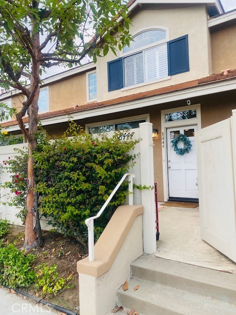 Upgraded 3 bedroom, 2.5 bathroom turnkey townhome in highly desired Summit Park community of Anaheim Hills. Light, bright, and open downstairs floorplan with separate dining area, raised breakfast-bar, and remodeled kitchen with beautiful countertops, stylish backsplash, shake-style cabinetry, range-top stove with oven below, separate microwave above, and side-by-side stainless steel fridge with pull-out freezer - all included. Recessed lighting, elegant crown molding, tasteful window coverings and fixtures, cozy fireplace, and laminate wood flooring and staircase to convenient half-bath leading to upstairs hallway with stacked laundry, full bathroom, nicely-sized bedrooms, and inviting master with vaulted ceilings and secluded en-suite with separated vanity, dressing area, and closet. Quiet, private, fenced front porch and tree-shaded patio adjacent to green area in front with an attached, direct-access two car garage with plenty of storage space to the rear of the unit. Low HOA dues with large community pool, spa, clubhouse, recreation rooms, gym, and children's playground. Easy freeway access to 91, 241, and 55 and close to grocery, shopping, dining, hiking, parks and much more.... Welcome home!