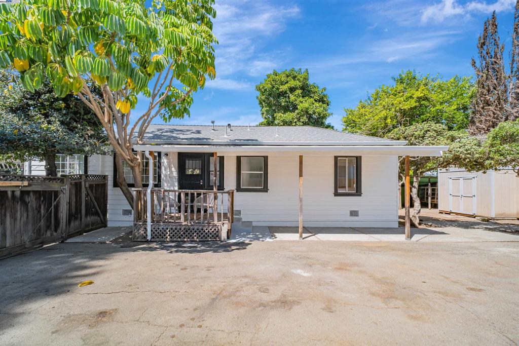 This charming sun-filled home that is only a five minute walk from downtown Castro Valley shopping, restaurants, and amazing schools is worth seeing for yourself. There are engineered wood floors throughout and the home consists of an open floor plan including the living room, kitchen, and dining room. The bedrooms are well-sized and both have adequate closet space, and one room has a sliding door to the backyard. The backyard and front yard offer plenty of room for entertaining, whether it is under the large pergola in the front with a decomposed granite surface, or in the shaded backyard with a very large avocado tree. You could even potentially build an ADU or make a grand addition with this oversized lot of 9,440 sqft. There is plenty of storage space as well - this home has one large shed, three additional smaller sheds, an awning for large tools, and a two car garage that has plenty of shelves/counter space for those that need room to tinker or store extra belongings. The driveway is massive, and can easily fit an RV, boat, or up to ten cars. This home features a new roof, updated electrical panel, and sewer lateral certification until 2055.
