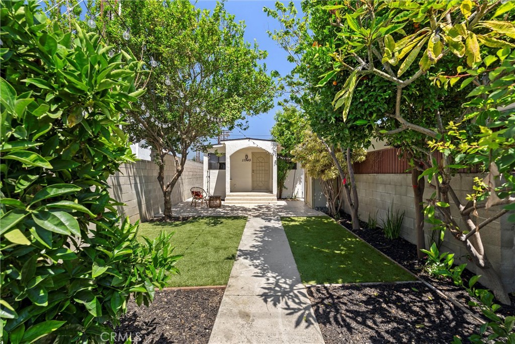 Enjoy Westside living with coastal access just minutes away. Tucked behind a private fence, this light-filled single-family home offers a rare opportunity to own in one of the area's most desirable neighborhoods. Thoughtfully updated and move-in ready, the home features a bright, open layout with two spacious bedrooms and a versatile bonus room—perfect for a home office, gym, media space, or creative studio.
Out front, a private yard surrounded by mature citrus trees creates a peaceful outdoor retreat ideal for relaxing or entertaining. Zoned R3, the property also holds future development potential for a buyer with vision.
Just steps from Playa Vista’s buzzing shops, restaurants, parks, and farmers market—and less than a 10-minute drive to the beach—this hidden gem offers unbeatable access to everything the Westside has to offer, including Culver City, Marina del Rey, Venice, and Santa Monica. A standout alternative to condo living with flexibility, charm, and location on its side.