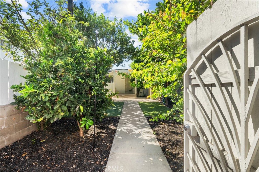 Enjoy Westside living with coastal access just minutes away. Tucked behind a private fence, this light-filled single-family home offers a rare opportunity to own in one of the area's most desirable neighborhoods. Thoughtfully updated and move-in ready, the home features a bright, open layout with two spacious bedrooms and a versatile bonus room—perfect for a home office, gym, media space, or creative studio.
Out front, a private yard surrounded by mature citrus trees creates a peaceful outdoor retreat ideal for relaxing or entertaining. Zoned R3, the property also holds future development potential for a buyer with vision.
Just steps from Playa Vista’s buzzing shops, restaurants, parks, and farmers market—and less than a 10-minute drive to the beach—this hidden gem offers unbeatable access to everything the Westside has to offer, including Culver City, Marina del Rey, Venice, and Santa Monica. A standout alternative to condo living with flexibility, charm, and location on its side.