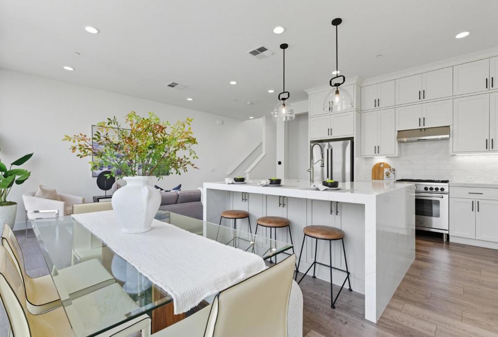 *LOW 2.5% INT RATE ASSUMPTION OPPORTUNITY* This is a truly exceptional and rare opportunity to save thousands on a monthly payment, and hundreds of thousands over life of loan. 4-bed/4-bath townhome built in 2022 and thoughtfully upgraded throughout. This spacious residence combines modern luxury with everyday convenience, featuring a fully SMART-tech enabled home system and high-end Italian appliances. Set within a highly sought-after community with a low HOA, this move-in-ready home offers the perfect blend of style, comfort, and location. Enjoy the vibrant Alameda Point lifestyle with nearby waterfront parks, Seaplane Lagoon, ferry terminals to San Francisco, excellent schools, and the lively Spirits Alley with award-winning breweries and distilleries. Homes in this community seldom come available. Don't miss your chance to secure a practically brand-new home with every upgrade already in place, including epoxy flooring in garage, plus EV hookups with ability to level 2 charge.