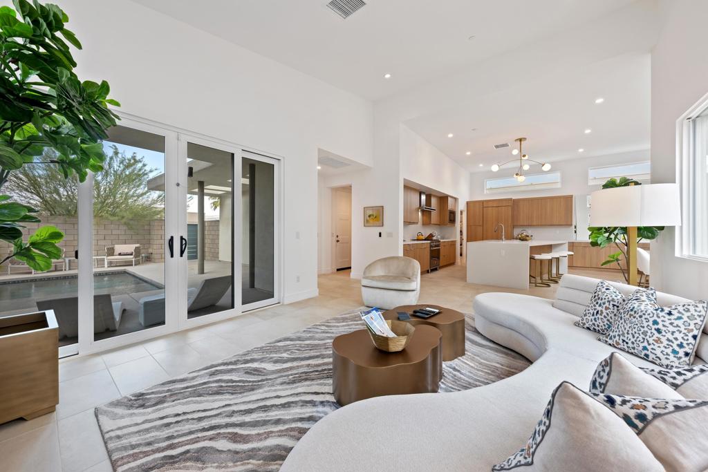 Experience modern luxury living at its finest in this pristine 3-bedroom, 3.5-bath home, perfectly designed for style, comfort, and entertaining. The expansive great room impresses with soaring ceilings, luxe accents, and walls of picture-frame windows and sliders that bathe the interiors in natural light.A seamless flow connects the chef's kitchen--appointed with high-end Bertazzoni appliances, elegant finishes, and a spacious dining area--making it ideal for both intimate gatherings and grand events.Each ensuite bedroom is a private retreat, enhanced with custom wallpaper and premium finishes. Outside, enjoy a private front patio complete with a sparkling cocktail pool, perfect for lounging under the desert sky, or enjoy a meal dining within the outdoor enclave. Additional highlights include owned solar panels, smart home technology, tankless water heater, a soft water system, and an owned security system with service available.This amazing home is move-in ready, with furnishings available outside of escrow.Set within the gates of Miralon, a Palm Springs' premier modern luxury resort community, residents are surrounded by seven acres of olive groves, a scenic lake, and miles of walking trails with breathtaking sunrise and sunset views. Exceptional amenities include two heated lap pools, spa, full-service fitness center, yoga studio, Wine Bar, BBQ area, fire pit area, bocce ball, event lawns, community U-Pick garden, dog parks, EV charging stations, and 24-hour gated security. Located just minutes from downtown Palm Springs, you'll enjoy easy access to boutique shopping, world-class dining, vibrant arts, and endless entertainment.Call now for a private viewing and let us show you what this exceptional home and community have to offer.